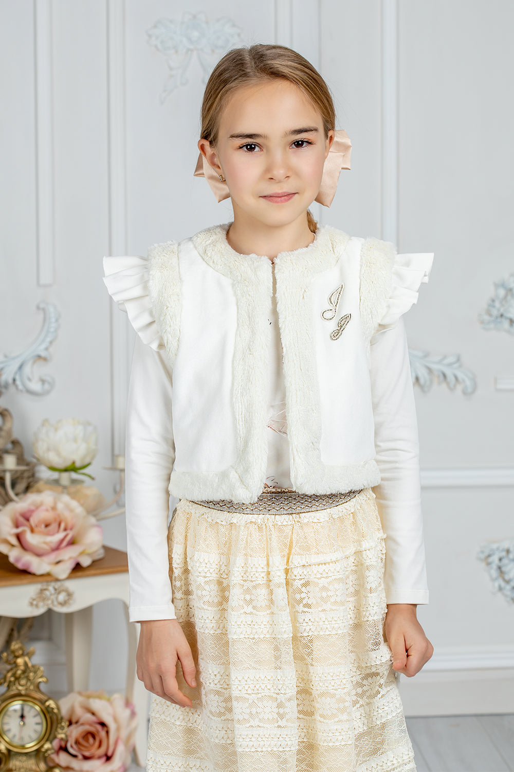 White faux fur vest with musical embroidery