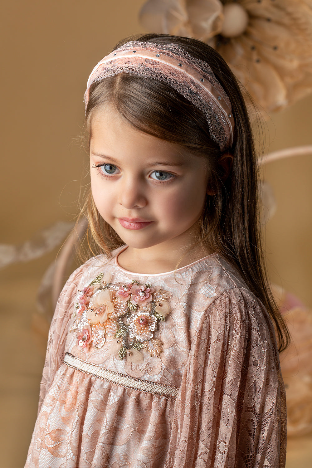 Pale pink pleated lace dress with a handmade embellishment