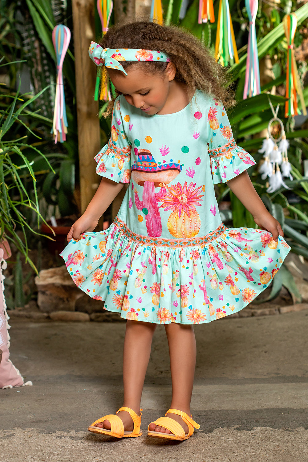 Mint cotton dress with big yellow and pink cactuses and matching trimmings