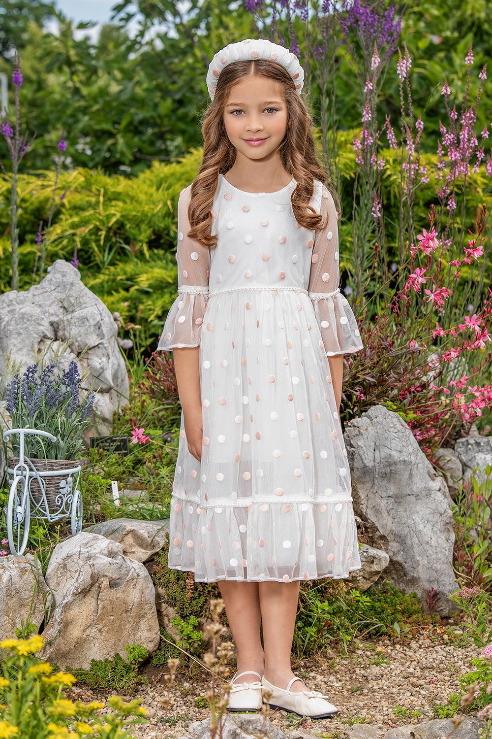 White tulle dress with pink dots and pearls