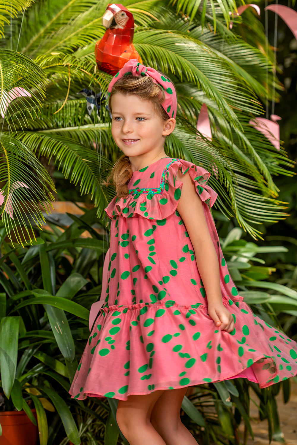 Coral viscose dress with green dots and frills