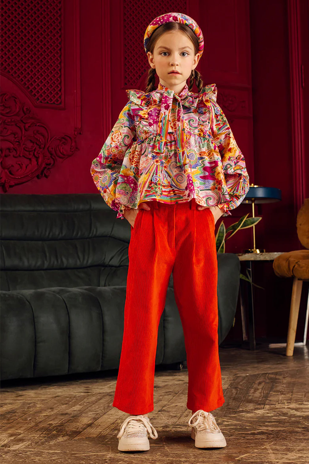 Bright orange cotton corduroy trousers with shimmering stripes