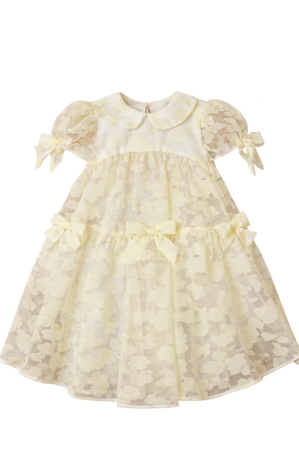 Pale yellow organza dress with texture, puff sleeves, and bows