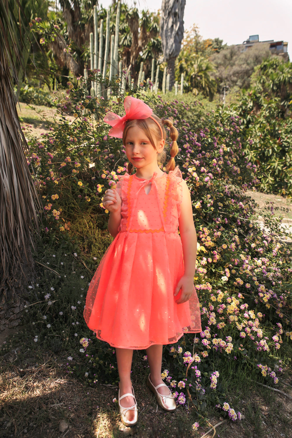 Coral neon dotted organza dress with bow