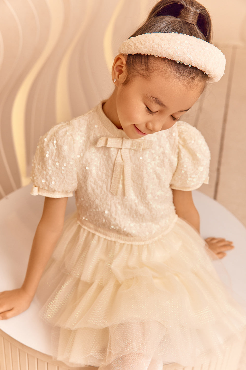 Ivory sequin and tulle glittery dress with bows