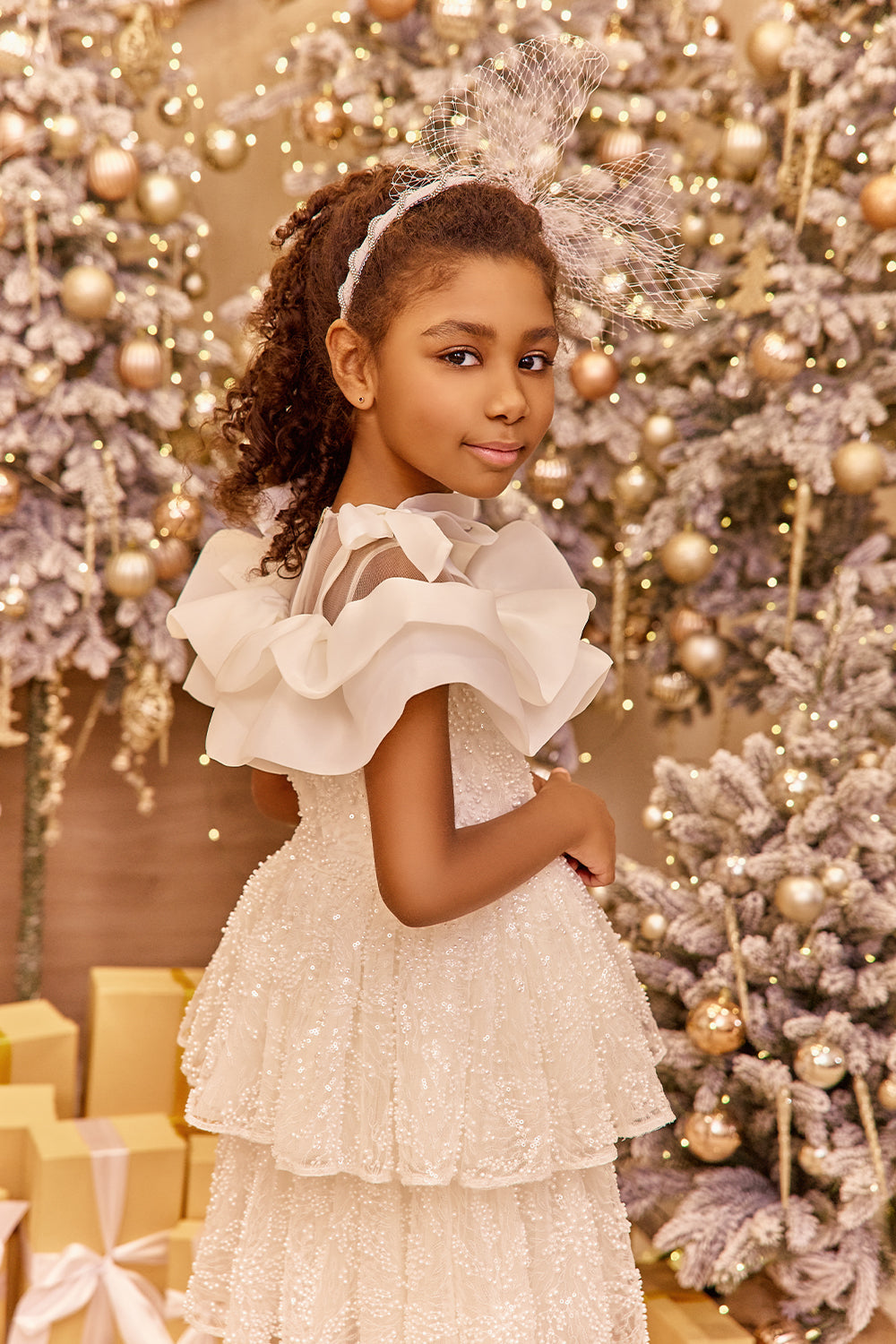 White pearl lace dress with organza frills and shoulder bows