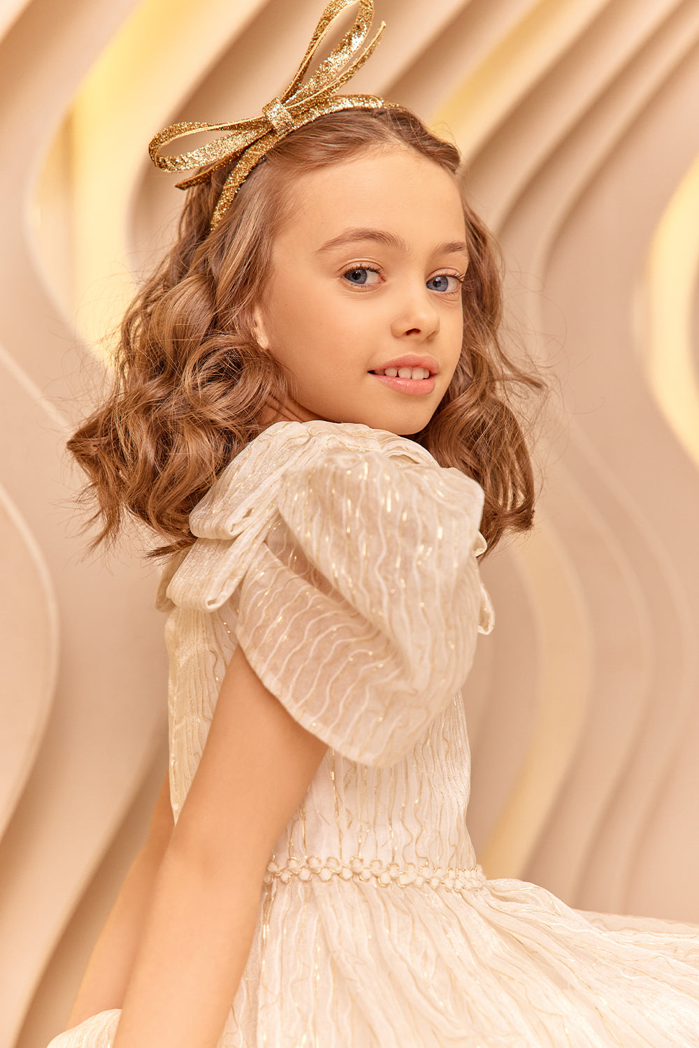 Ivory and gold threads dress with shoulder bows