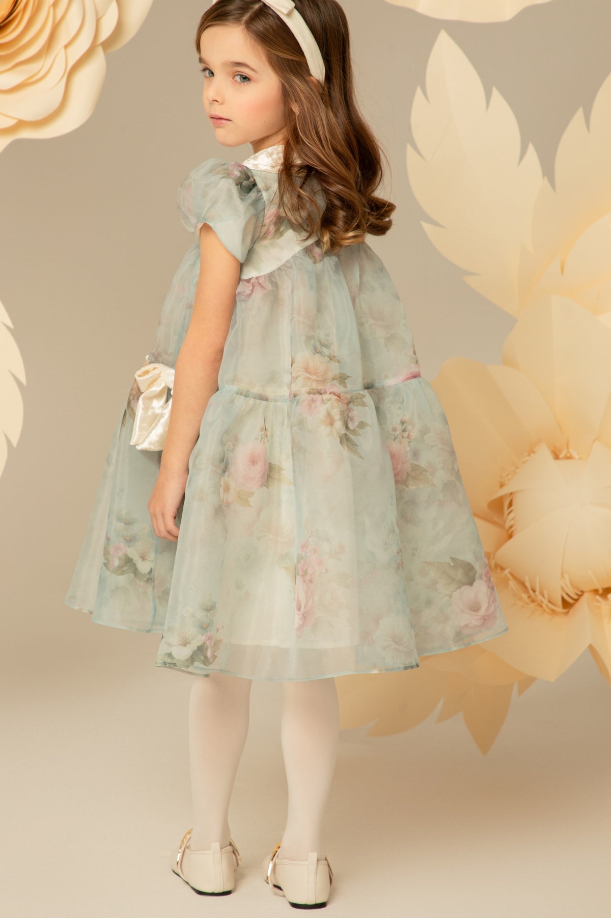 Side view of a pastel blue floral dress with velvet collar