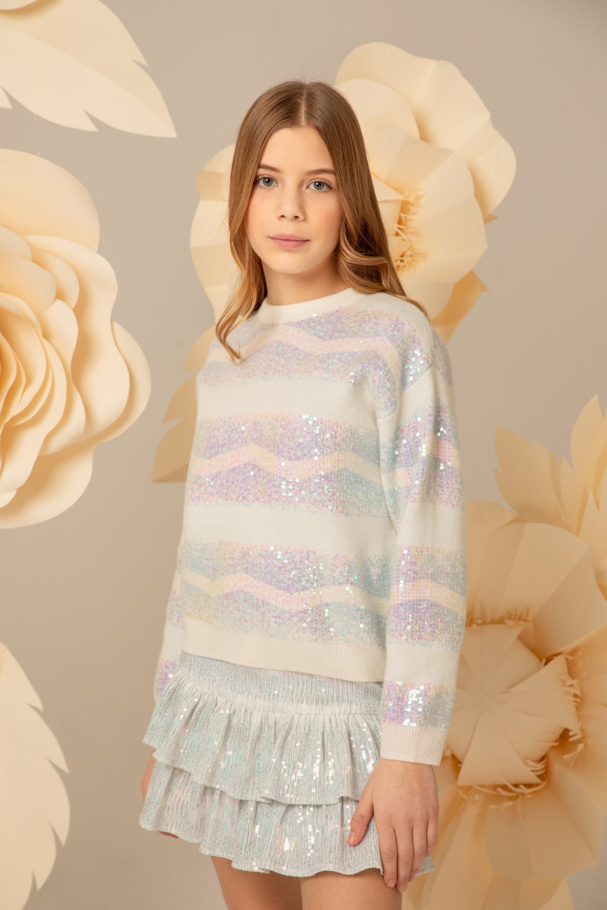 Pastel striped sequin sweater worn with a matching skirt