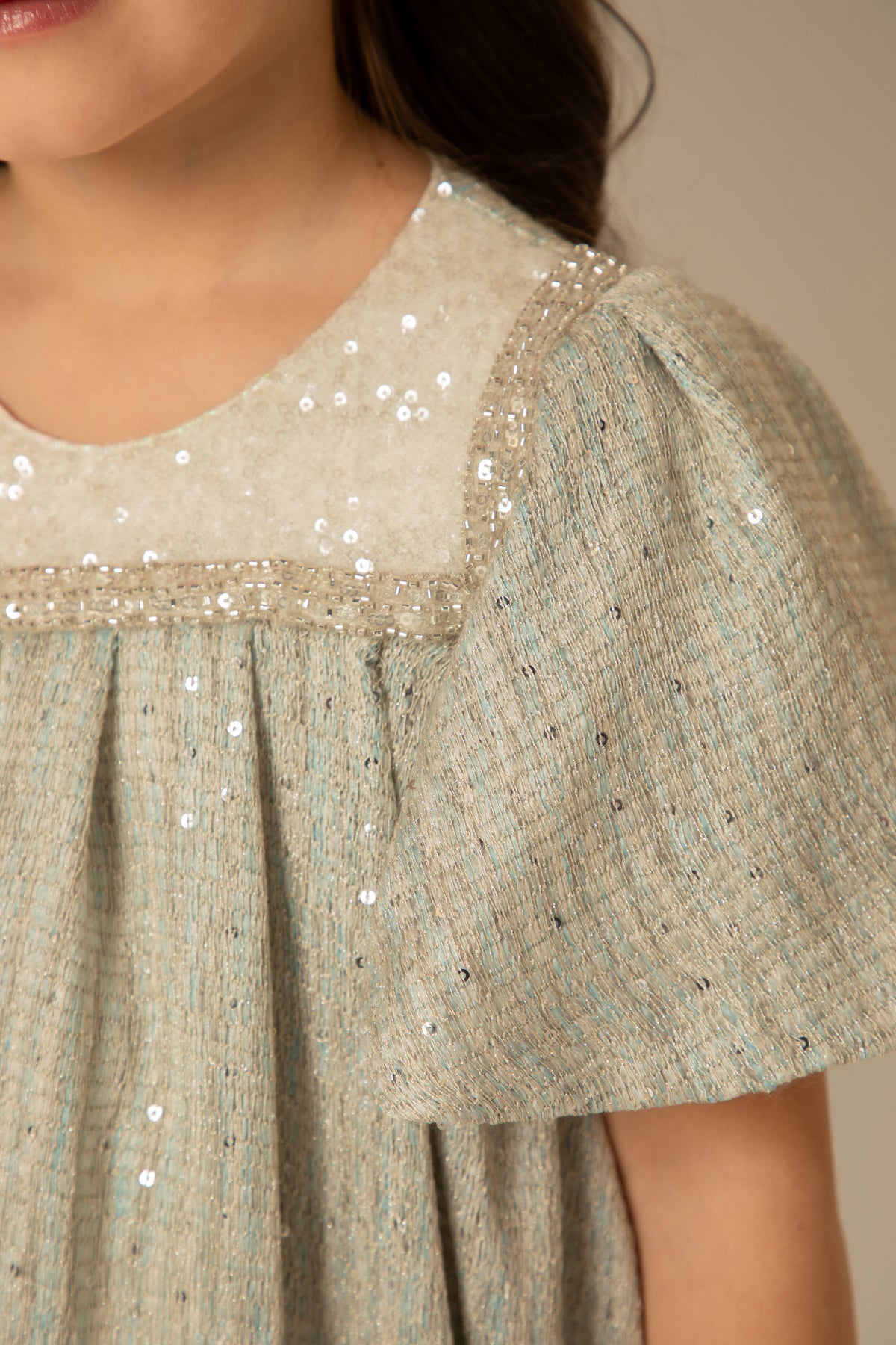 Close view of the cream beaded yoke