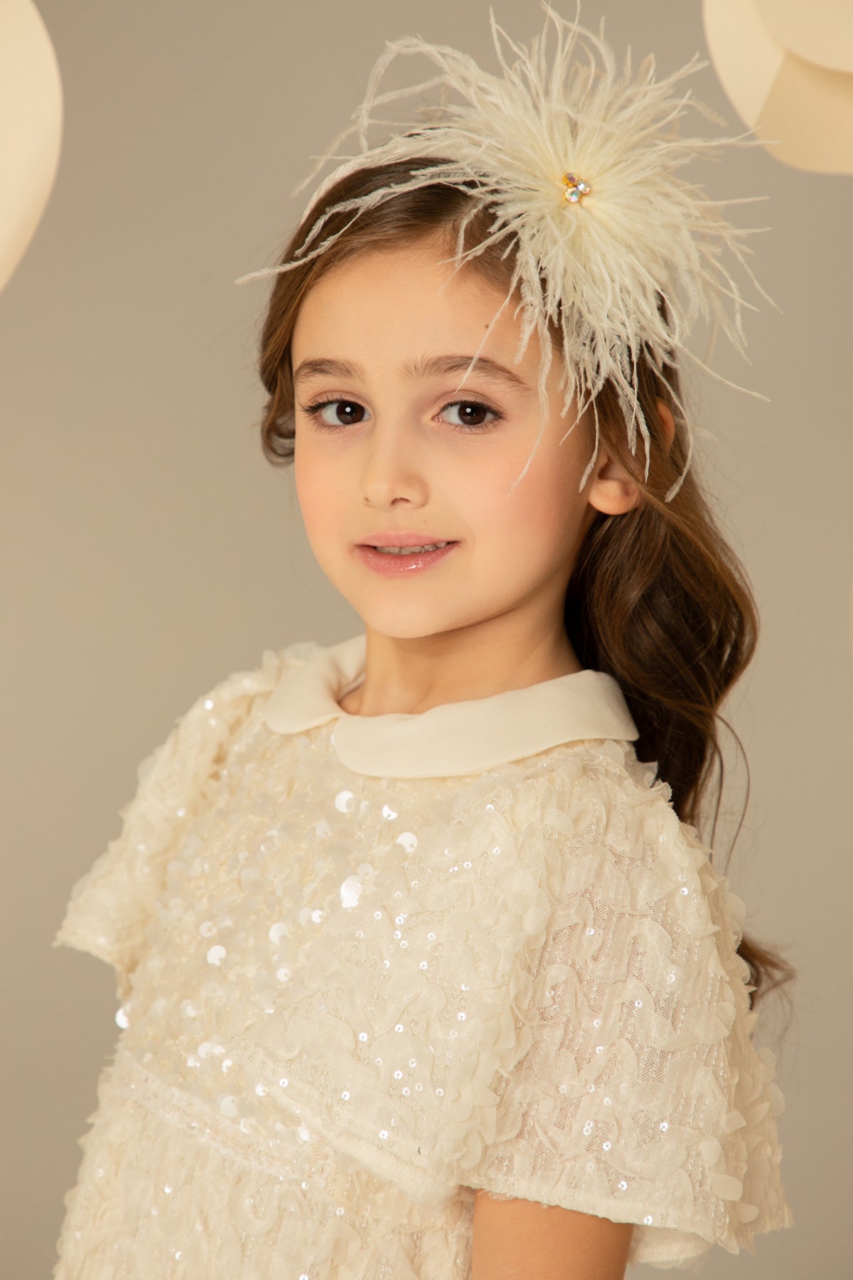 Close-up of the sequins and Peter Pan collar