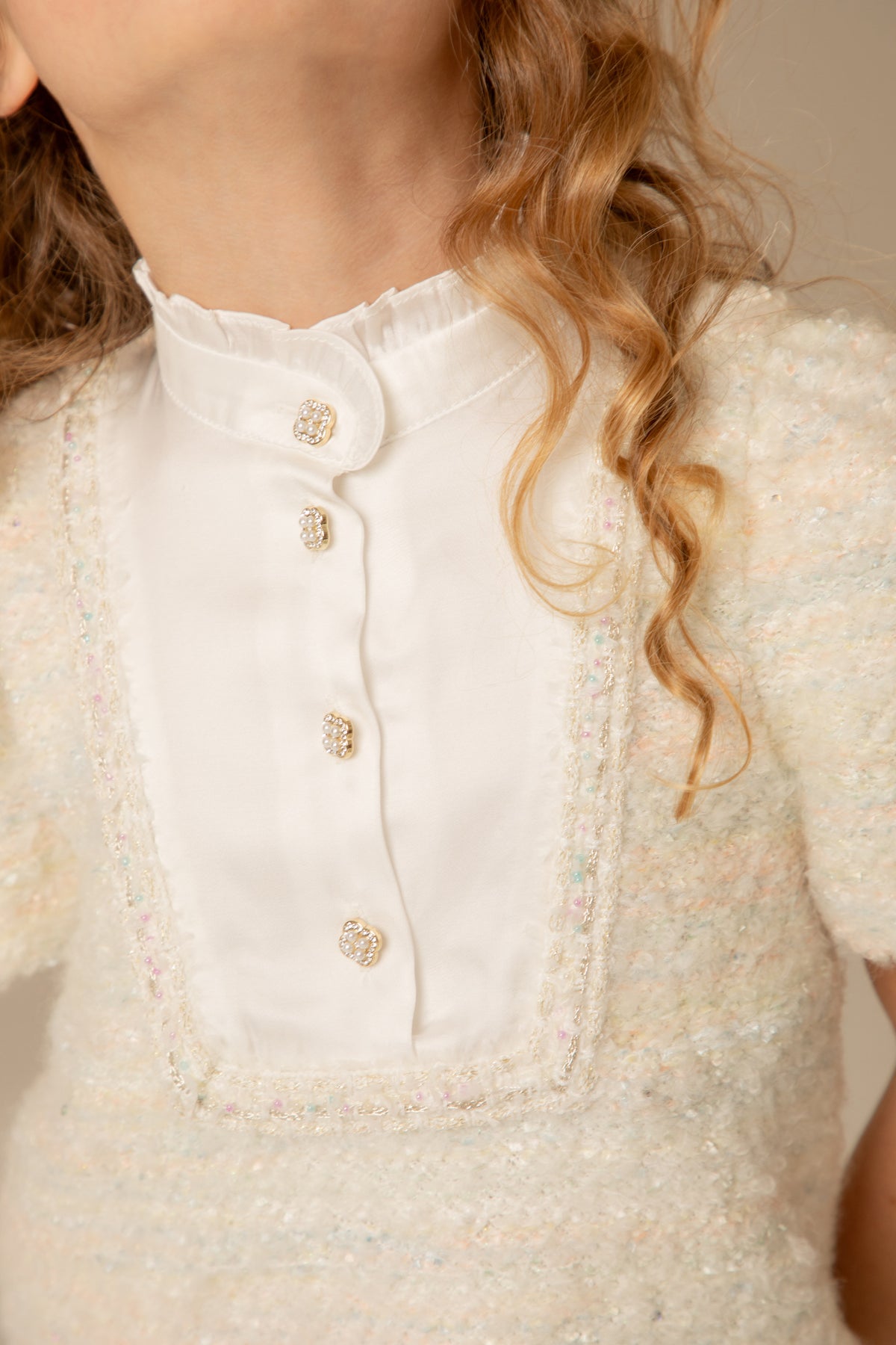 Close view of the satin bib and buttons
