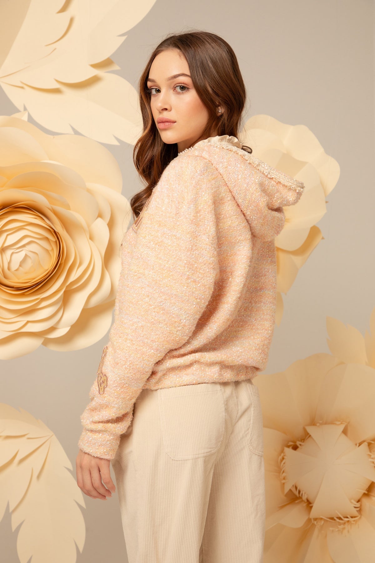 Side view of the peach tweed hoodie