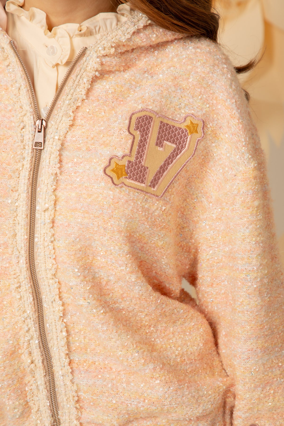 Close view of the zip and chest patch