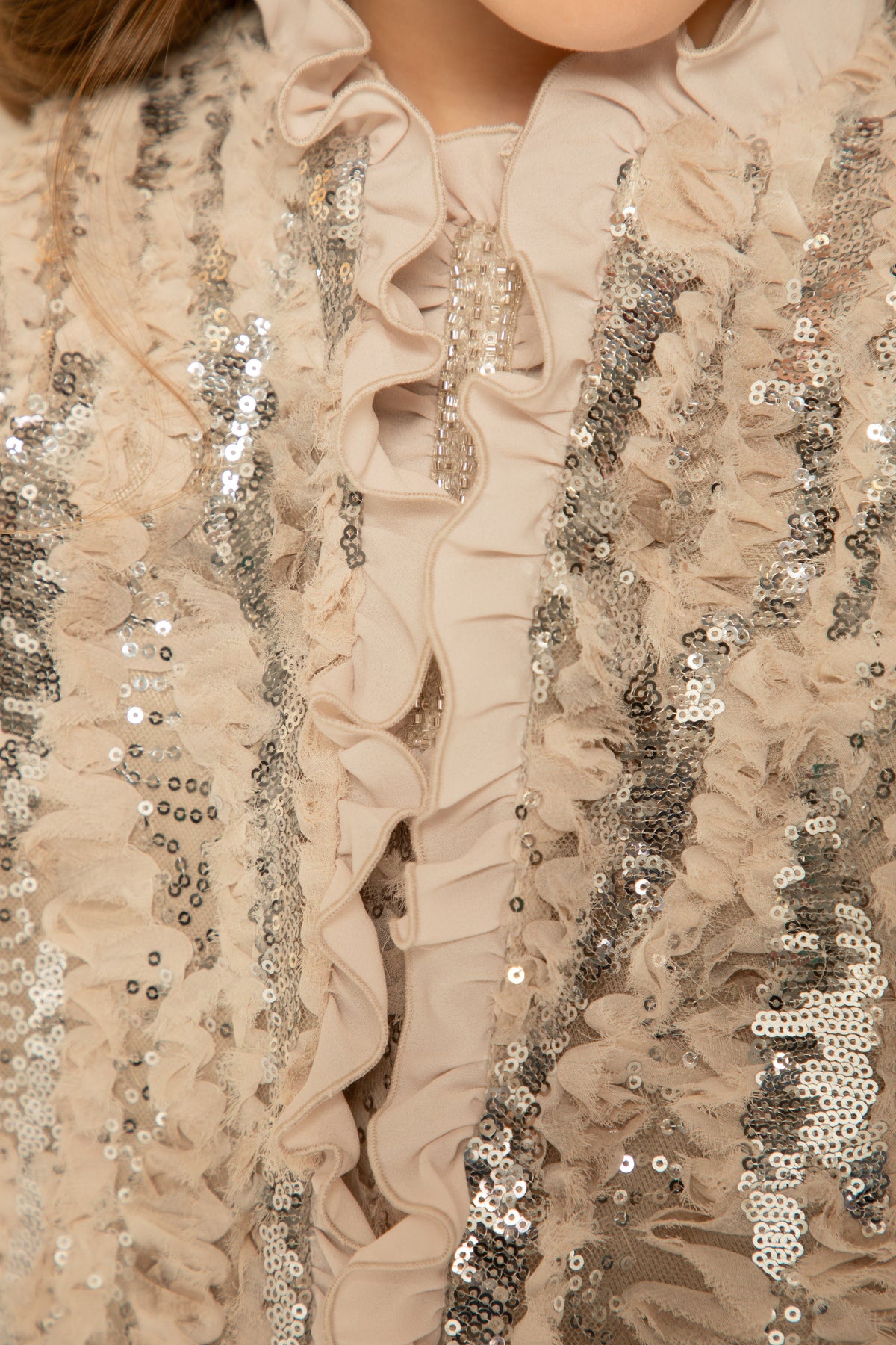 Close view of the ruffle trim and silver sequins