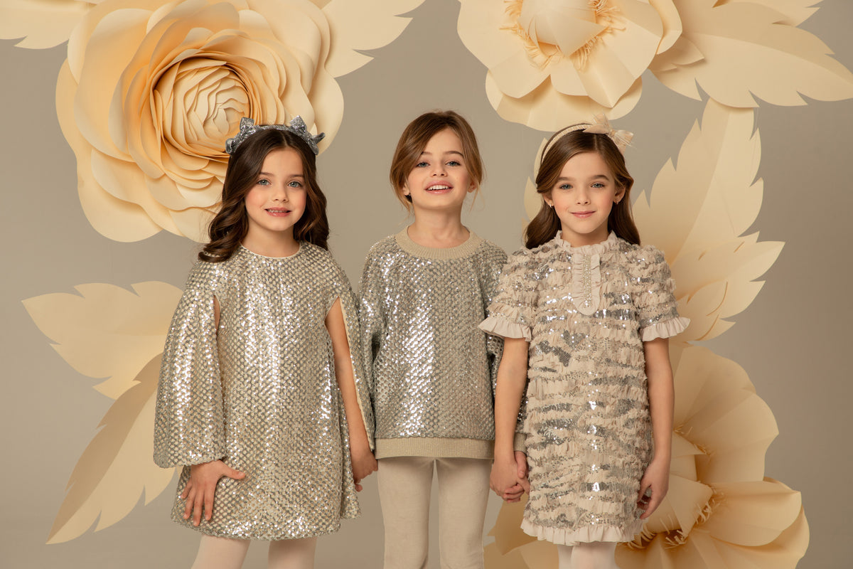 Girls in sequinned party dresses from the EIRENE collection