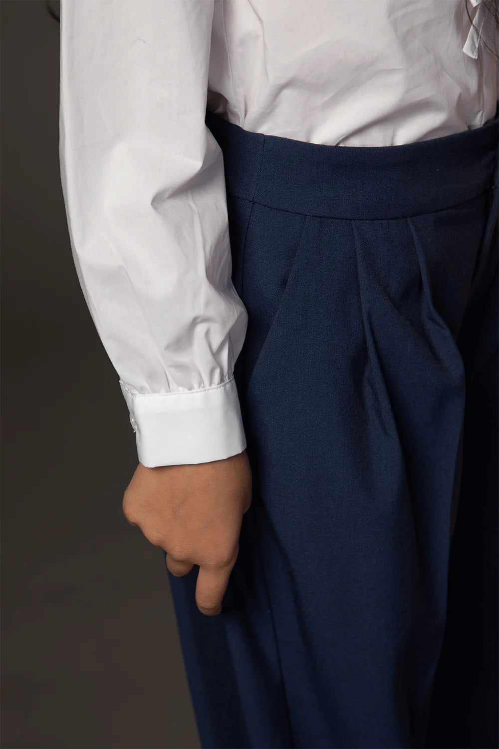 White blouse with shoulder ruffles, bows and oversized rounded collar