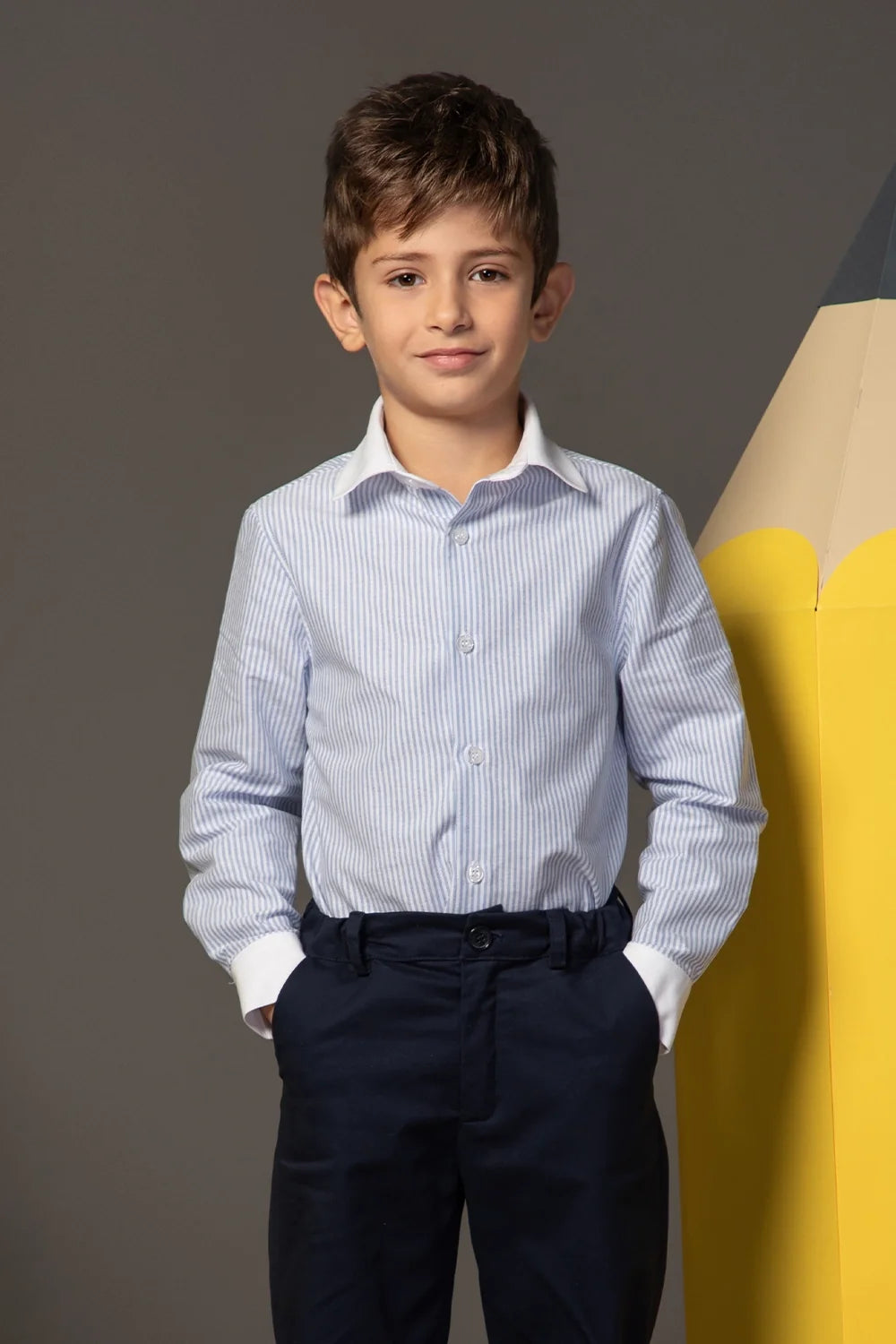 Light blue and white striped shirt with buttons, a classic collar and white cuffs