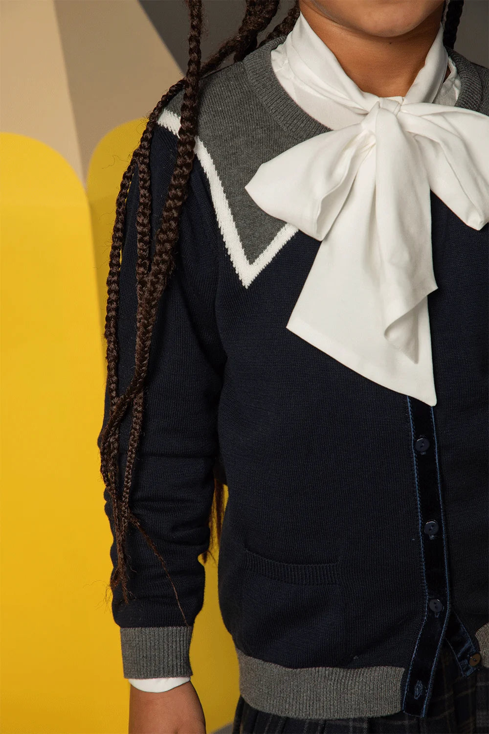 Navy cotton cardigan with grey trim, white details, buttons and pockets