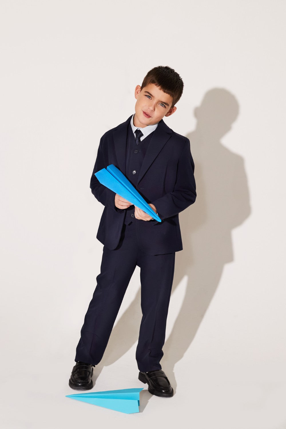 Blue woven trousers made from polyester, viscose, and elastane.