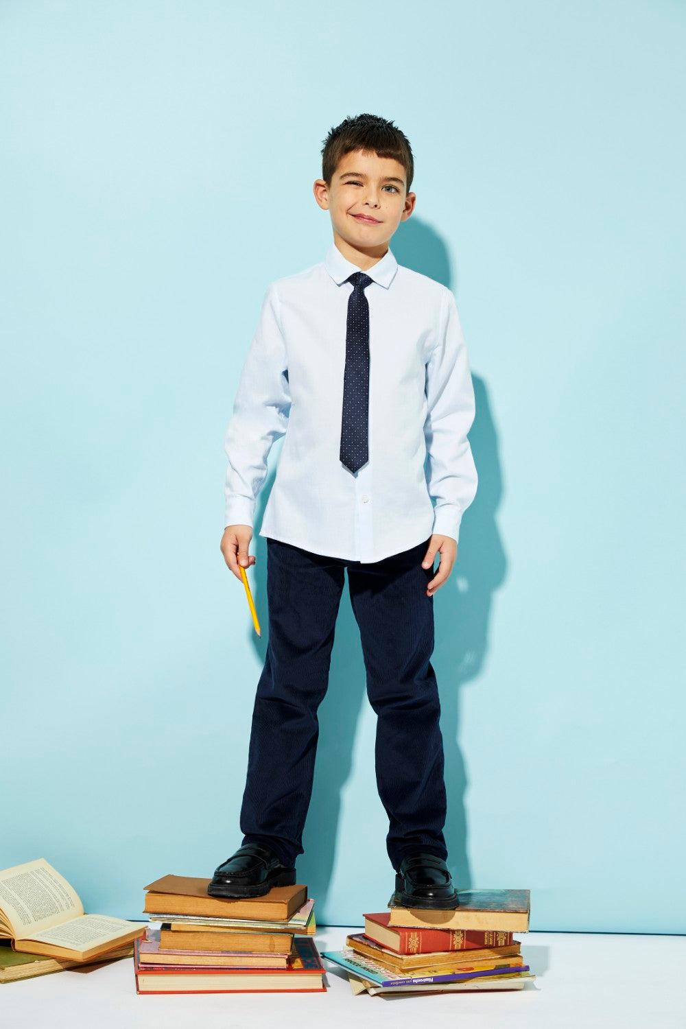 Blue woven corduroy trousers made from 100% cotton are a versatile children's clothing option.