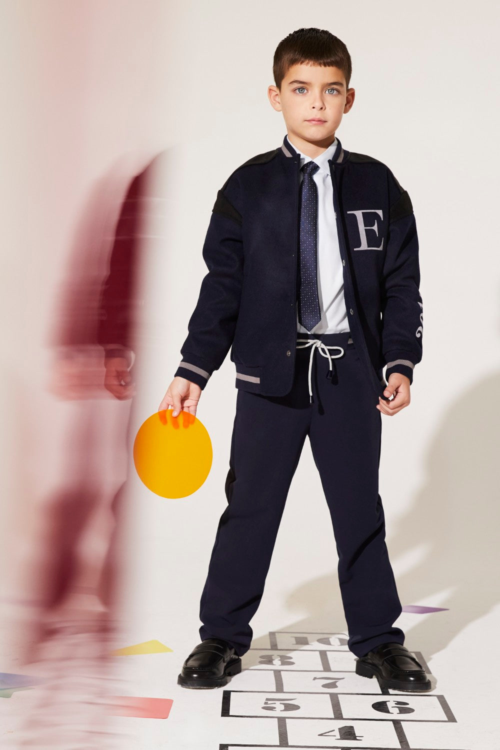 Blue woven bomber jacket with polyester and viscose blend lining.