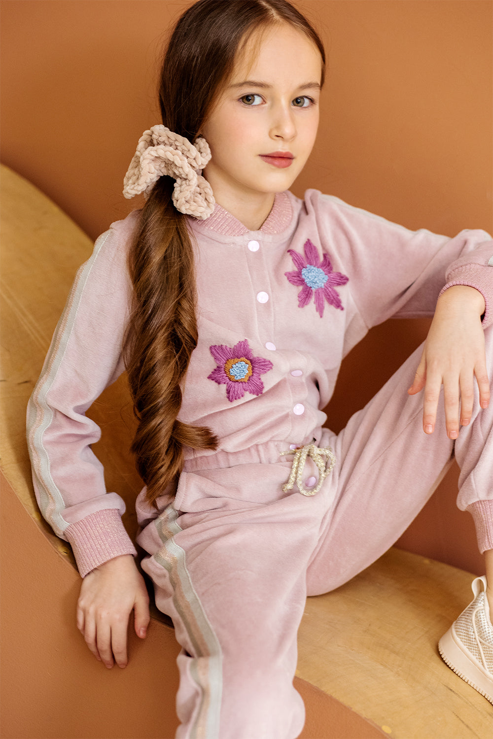 Pink cotton velvet jumpsuit with lurex stripes and hand-made flower embroidery