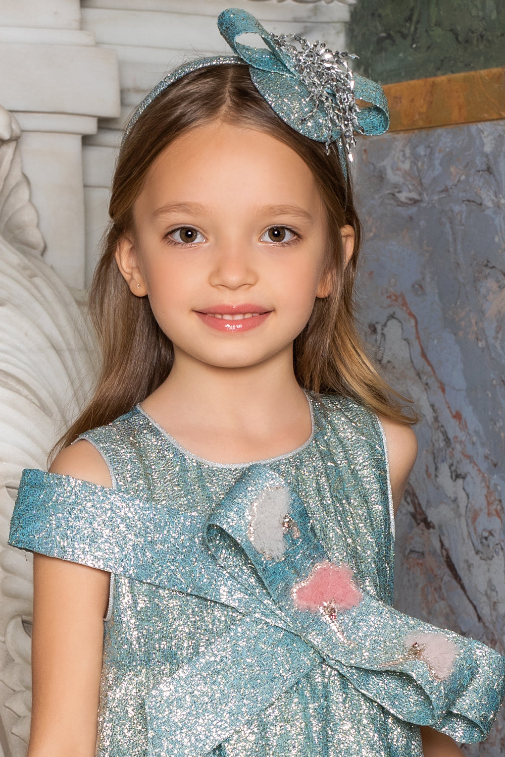 Blue shimmering headband with silver decoration