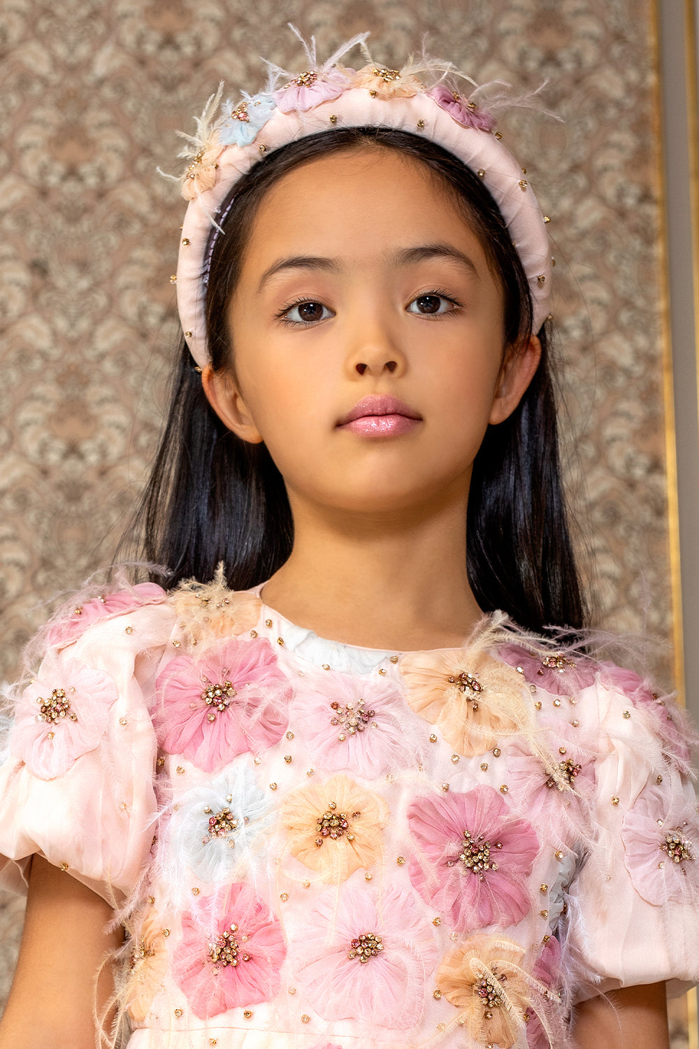 Pale pink headband with hand-embellishment of flowers with crystals and feathers