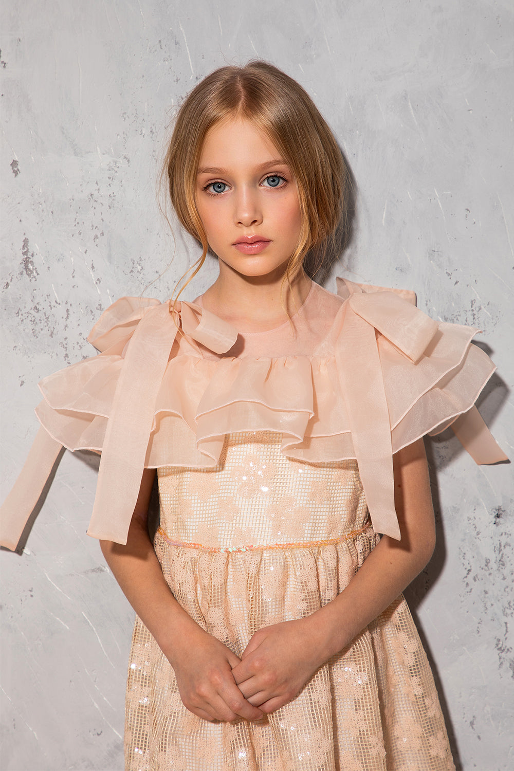 Peach floral lace dress with organza frills and shoulder bows