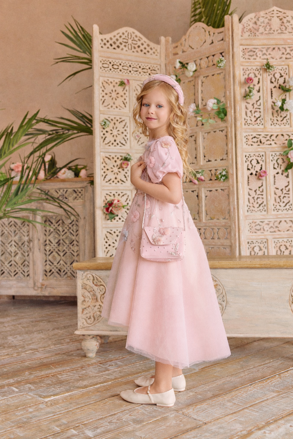 Young girl in a pink dress.