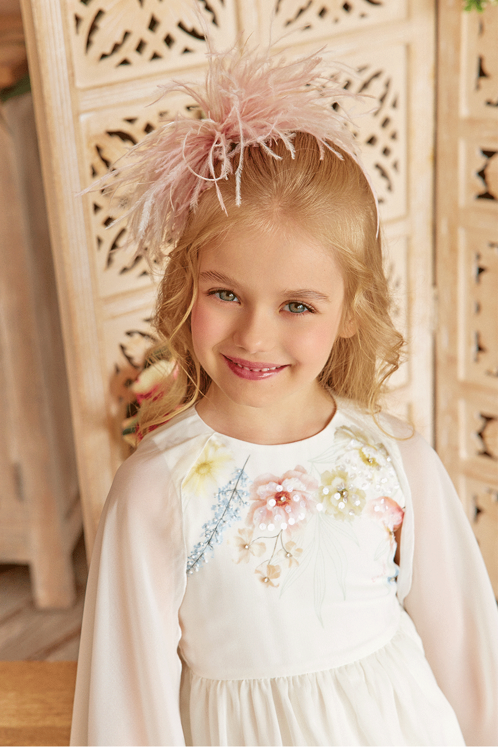 White chiffon dress with floral print, flowing sleeves and delicate hand-embelishement