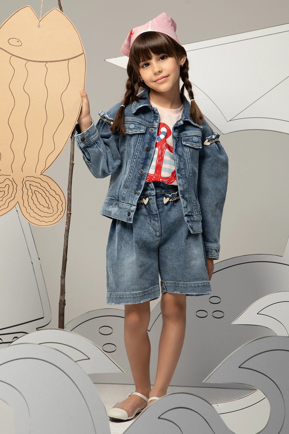 Denim jacket with puffed sleeves, heart gold chain details, and front button closure