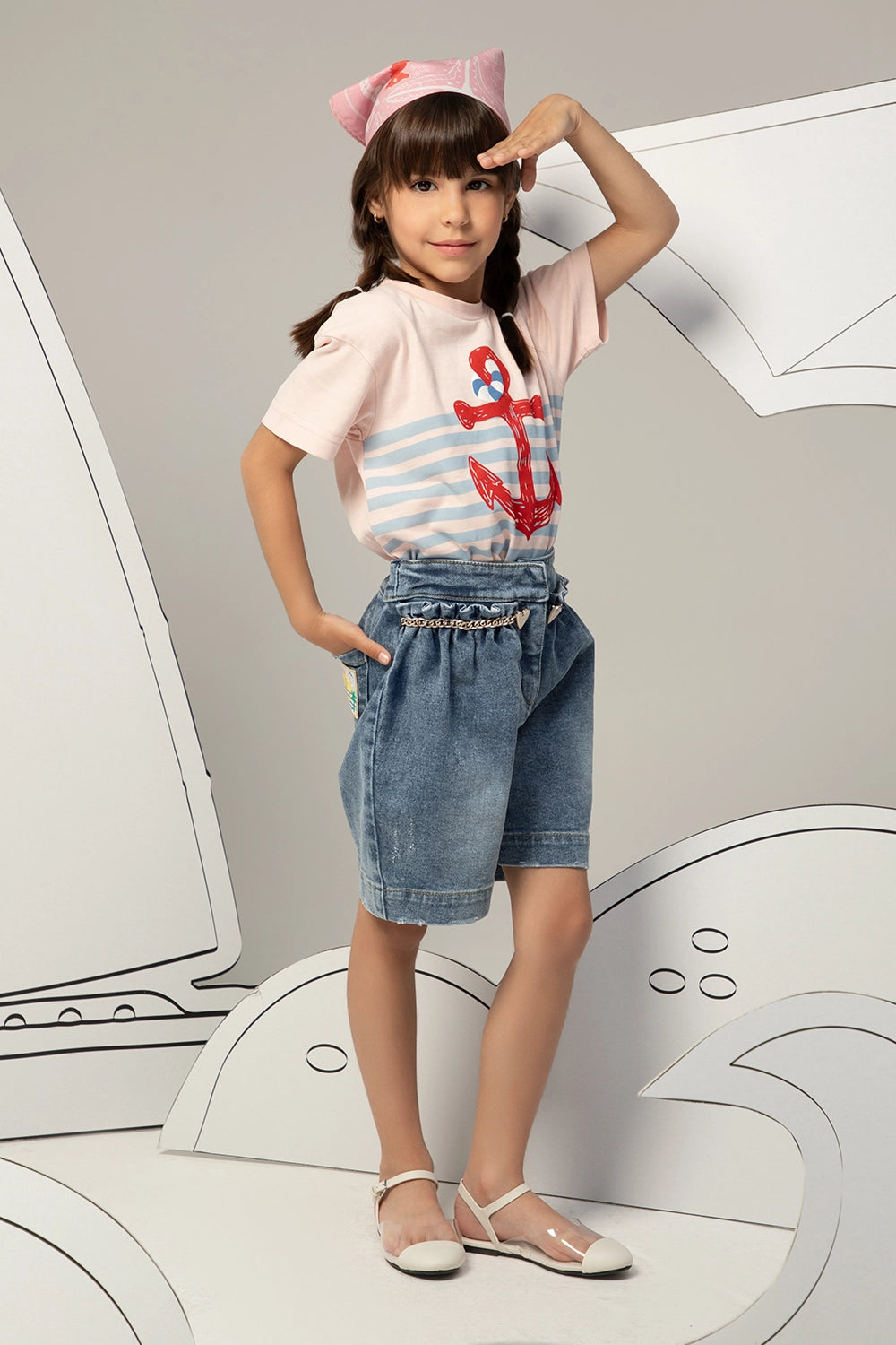 High-waisted denim shorts with a ruffled waistband, heart charm chain, and a relaxed, wide-leg fit