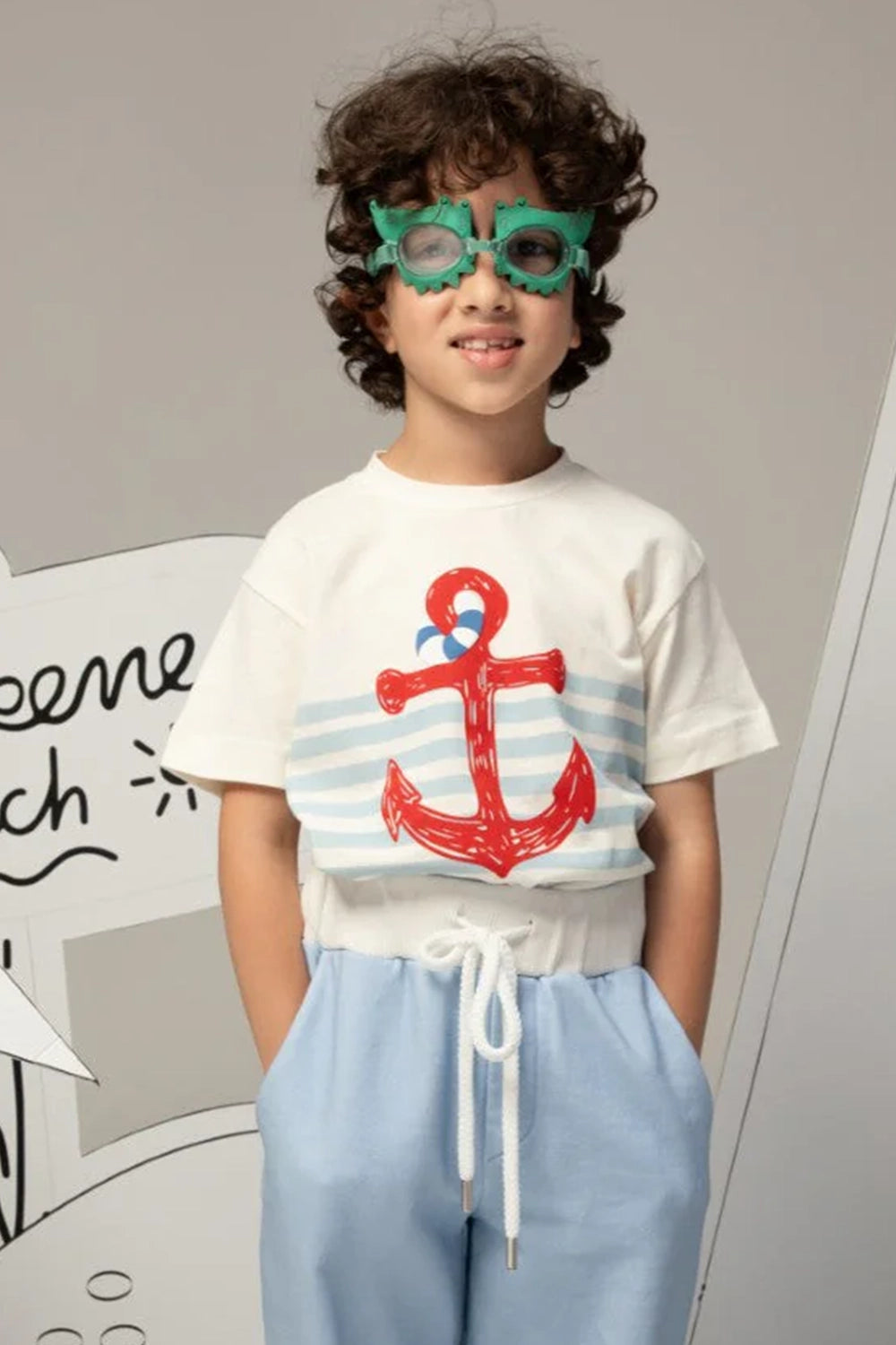 Off-white t-shirt with light blue stripes and a large red anchor print