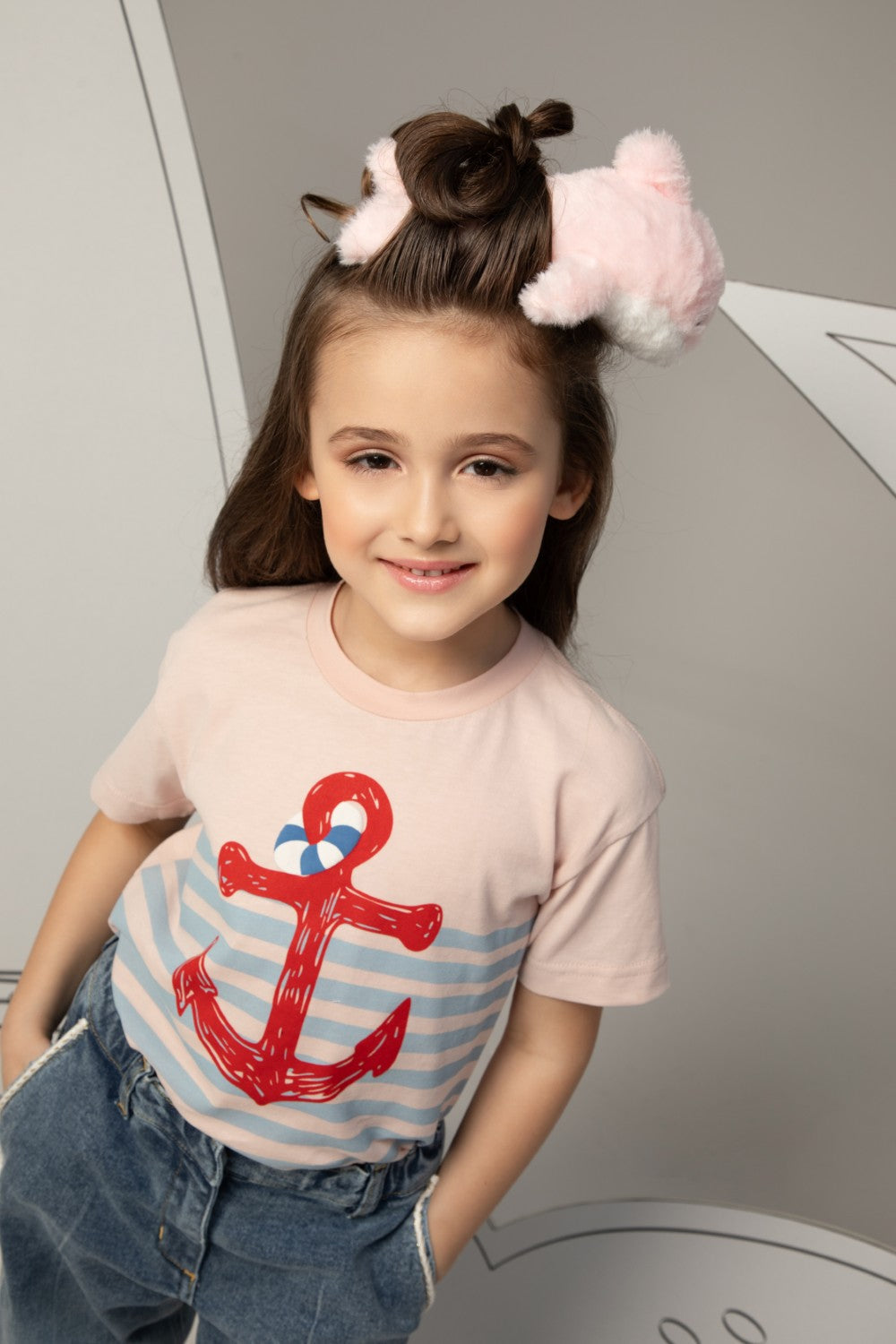 Pink t-shirt with light blue stripes and a large red anchor print