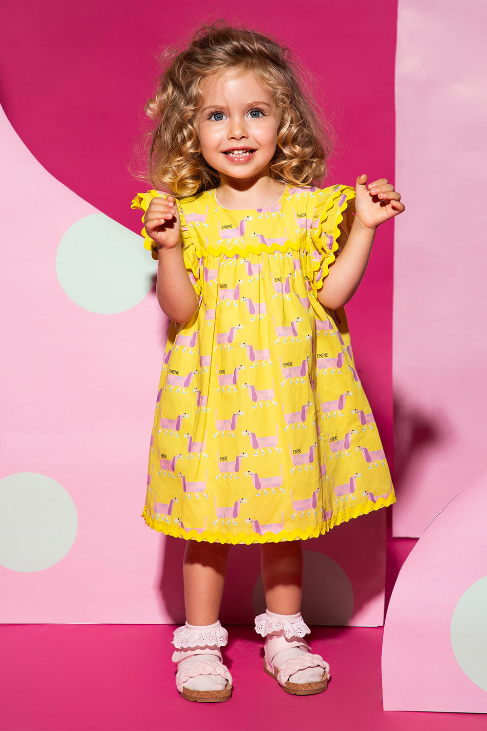 Yellow satin cotton baby dress with dachshund print