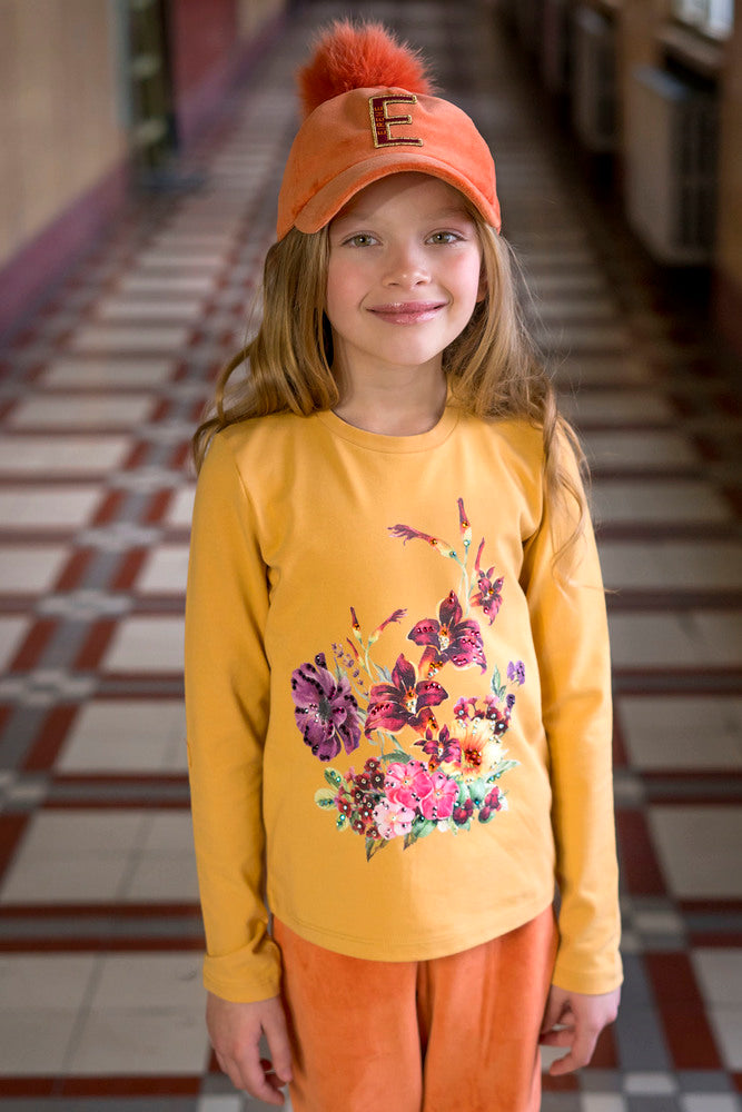 Bright orange top with print and Swarovski crystals