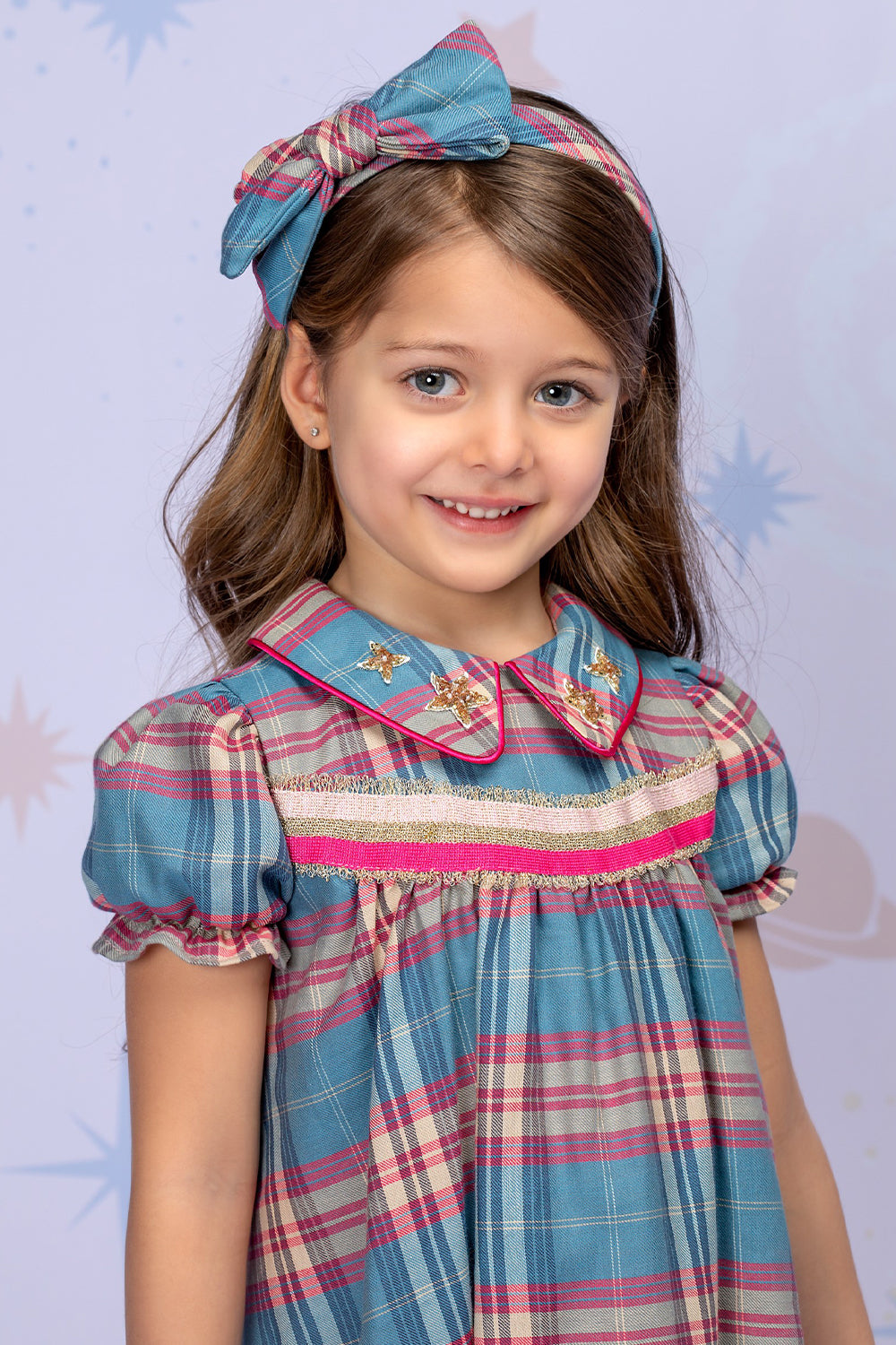 Fuchisa and blue plaid dress with a collar and handmade stars embellishments