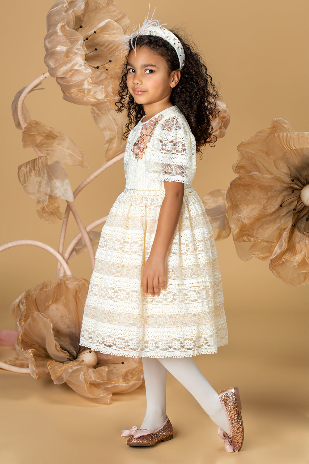 Ecru lace dress with short sleeves and a handmade embellishment