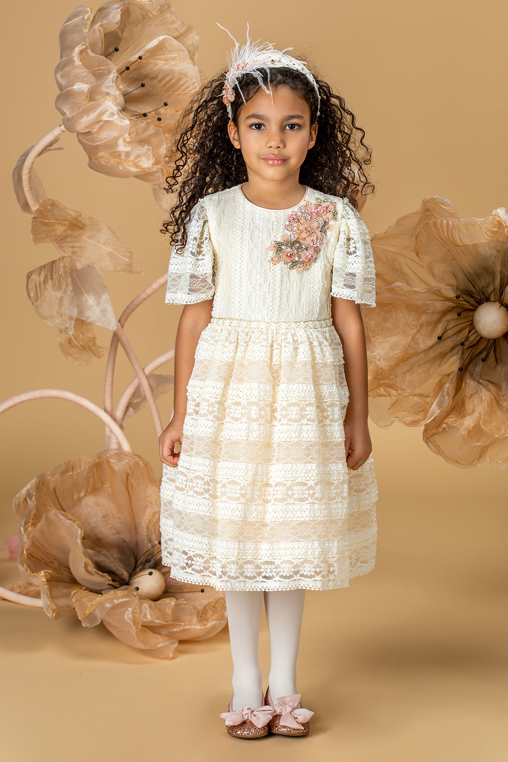Ecru lace dress with short sleeves and a handmade embellishment
