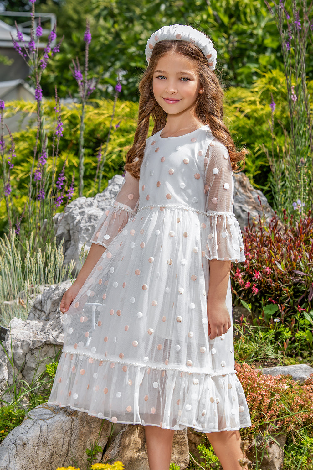White tulle dress with pink dots and pearls
