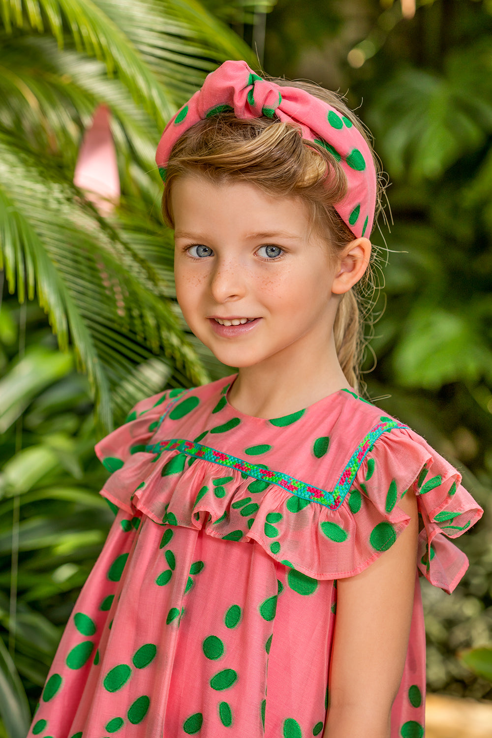 Coral viscose dress with green dots and frills