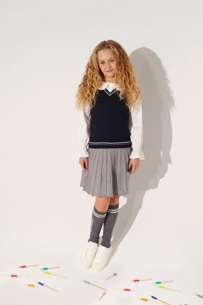 Charming white shirt with a classic Peter Pan collar offers a touch of timeless elegance for any young one.