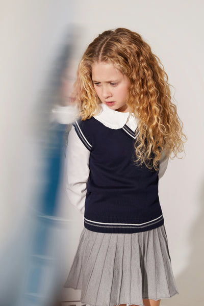 Charming white shirt with a classic Peter Pan collar offers a touch of timeless elegance for any young one.