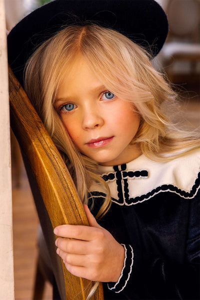 Black velvet dress with white corduroy collar and bow