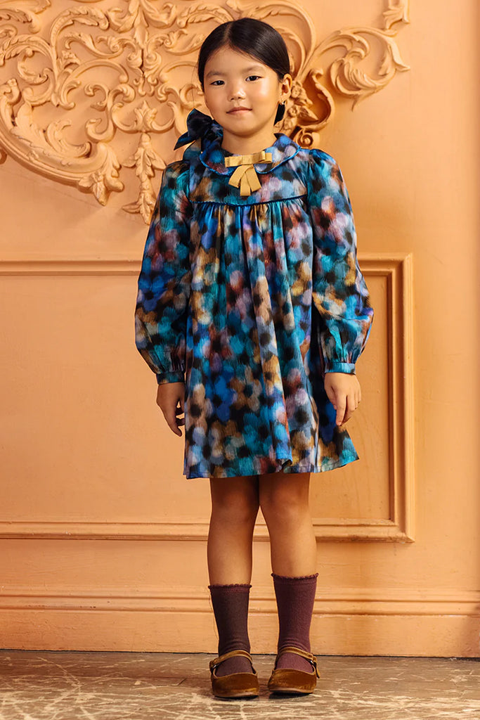 Blurred blue and beige flowers cotton Liberty Tana Lawn dress with gold bow and blue velvet piping
