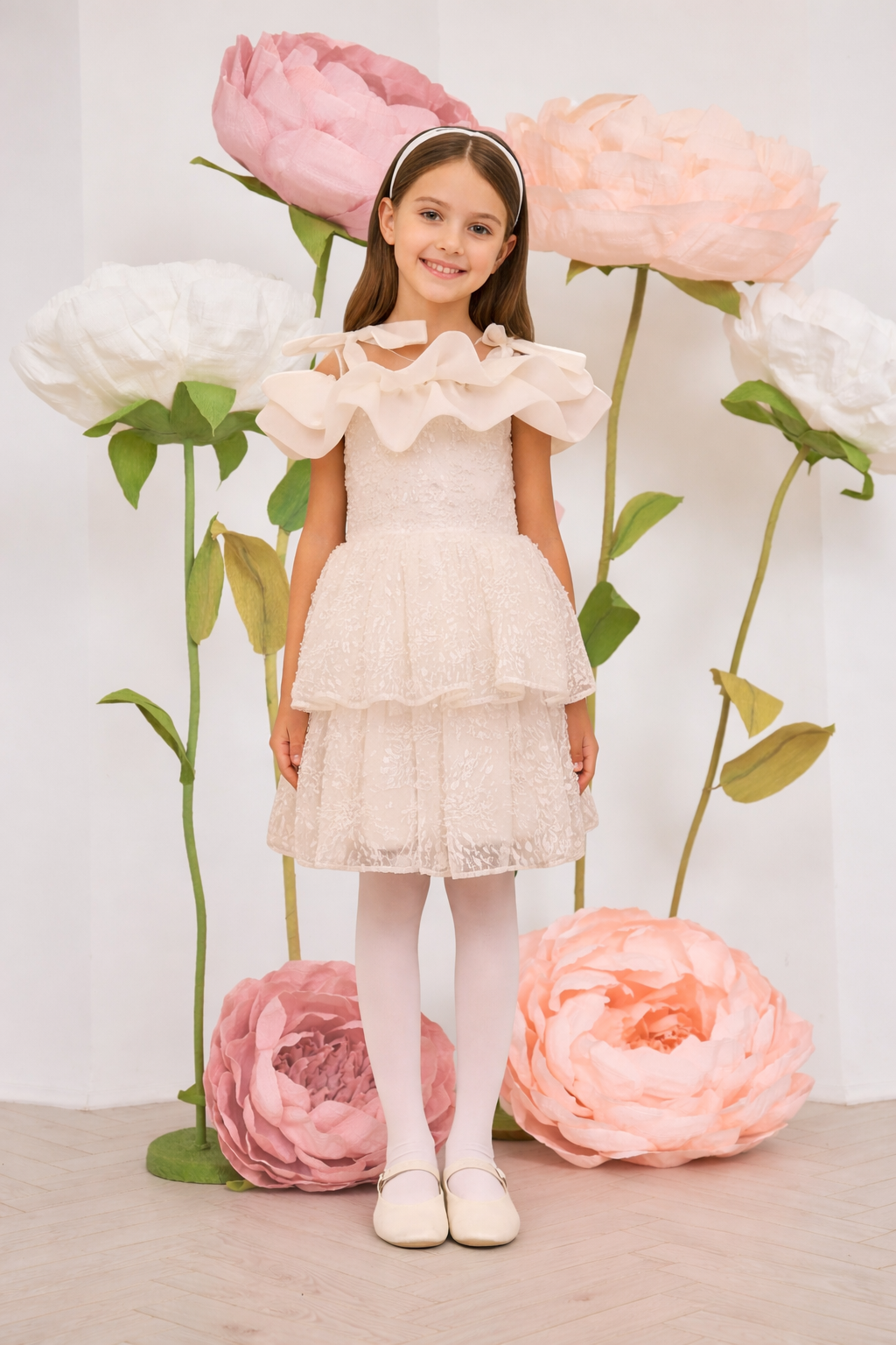 White pearl lace dress with organza frills and shoulder bows