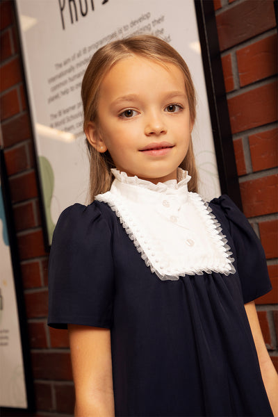 Dark blue dress with white collar, pearls and tulle decoration