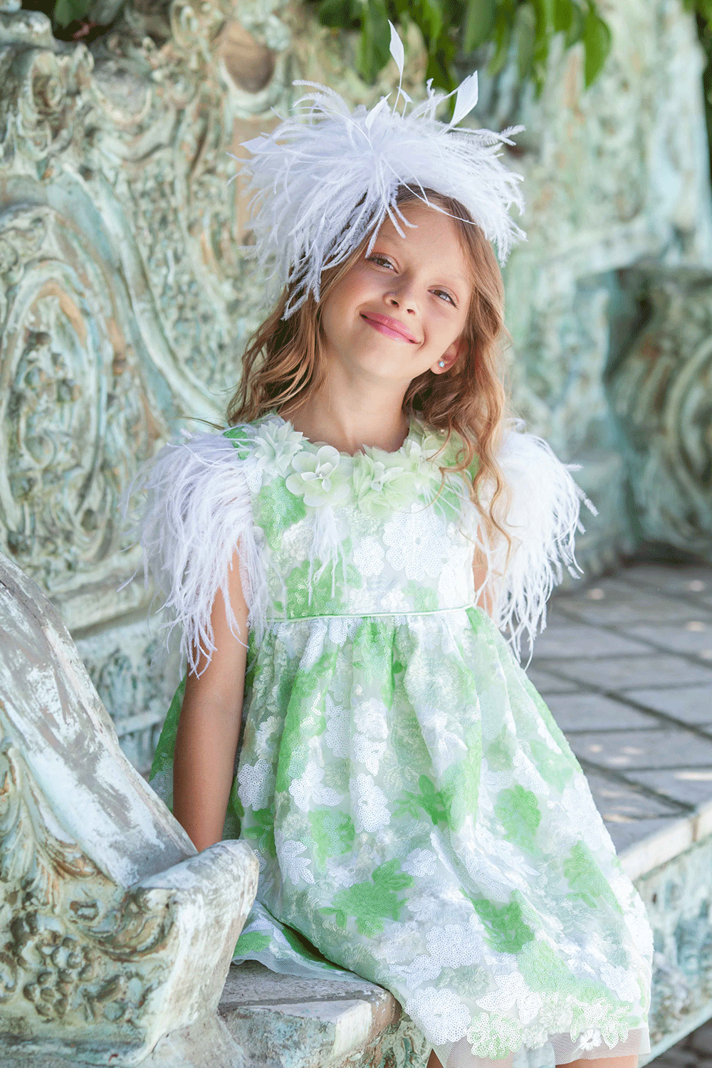 Green and white floral sequin lace dress with white feathers and hand-made embellishments